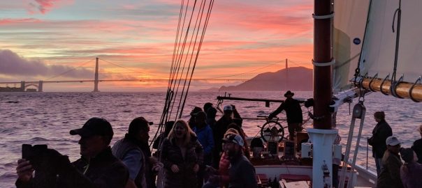 Boat tour on San Francisco Bay with evening sunset colors